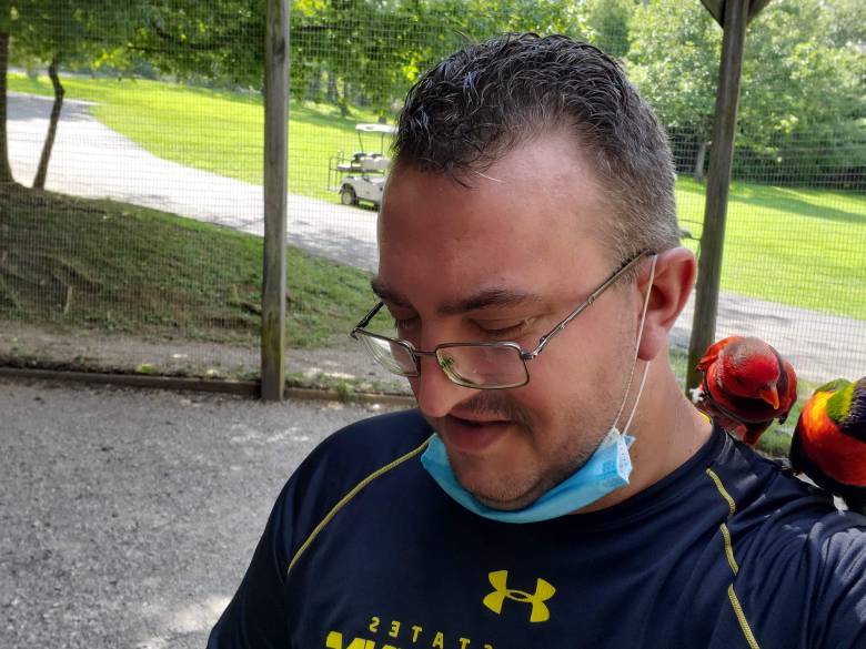 guy with lorries sitting on shoulder at Kentucky Down Under